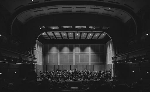 surgeon in dark room performing an operation